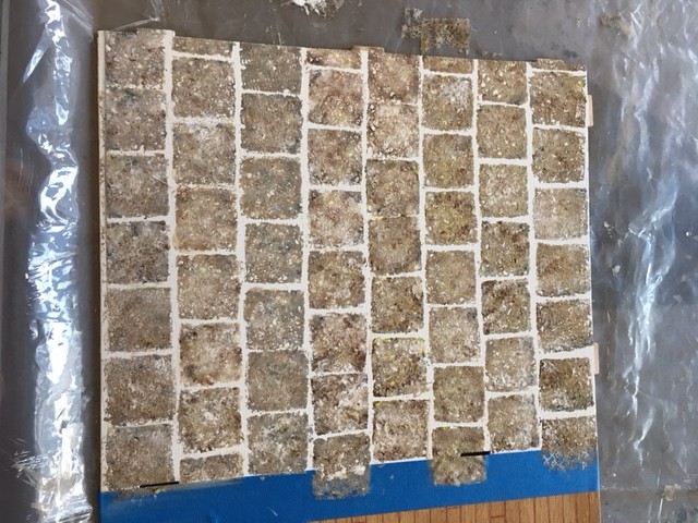 stamped tile floor with all surfaces done-raw